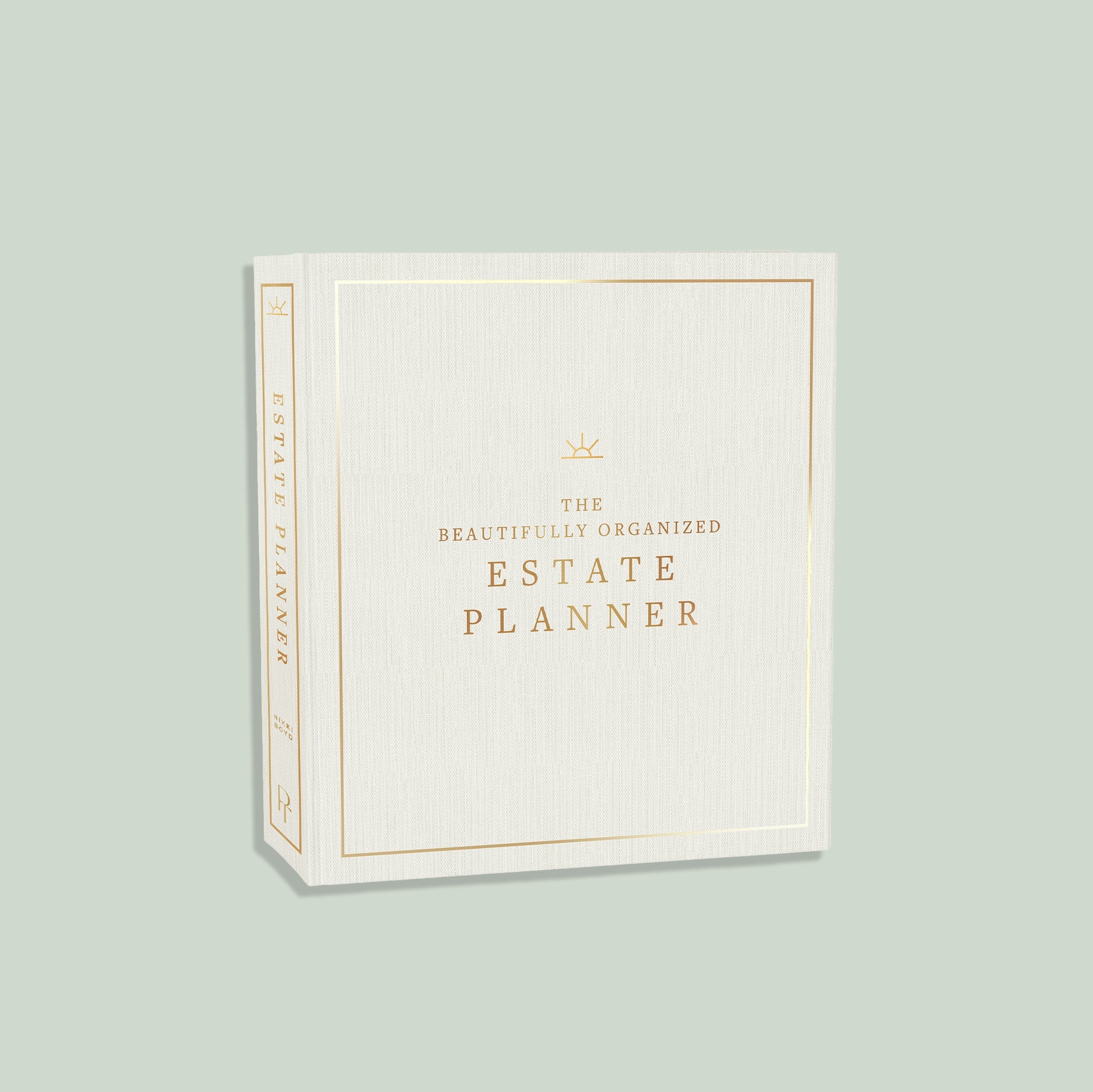 White planner with gold text on a light green background