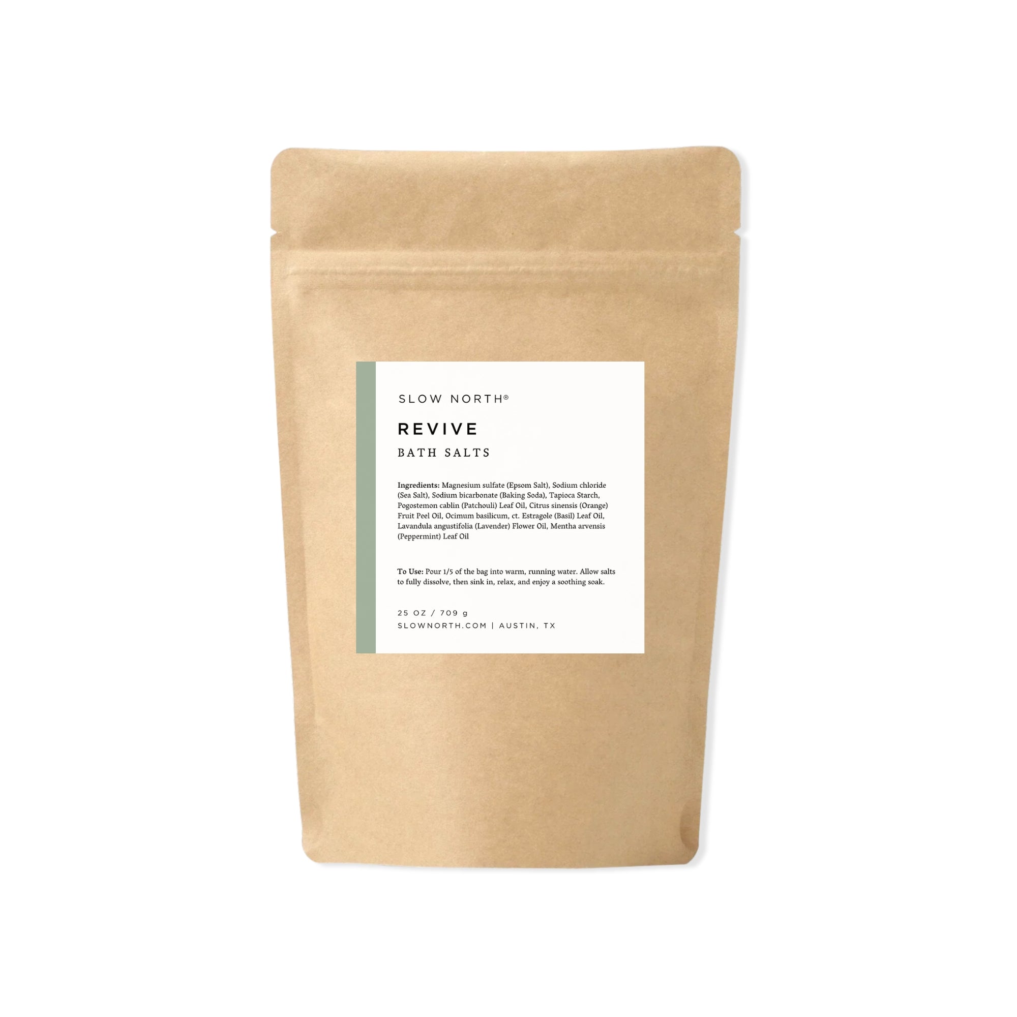 Kraft paper packaging with a label for 'Revive' bath salts from Slow North on a white background